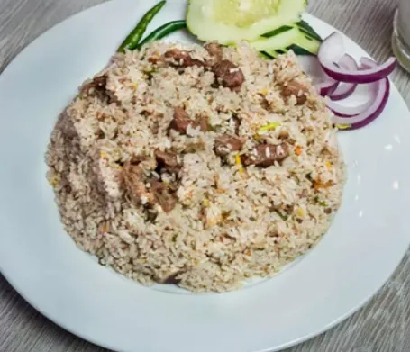 Beef tehari served with salad